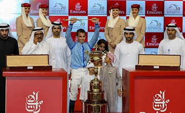 William Buick with the Dubai World Cup trophy